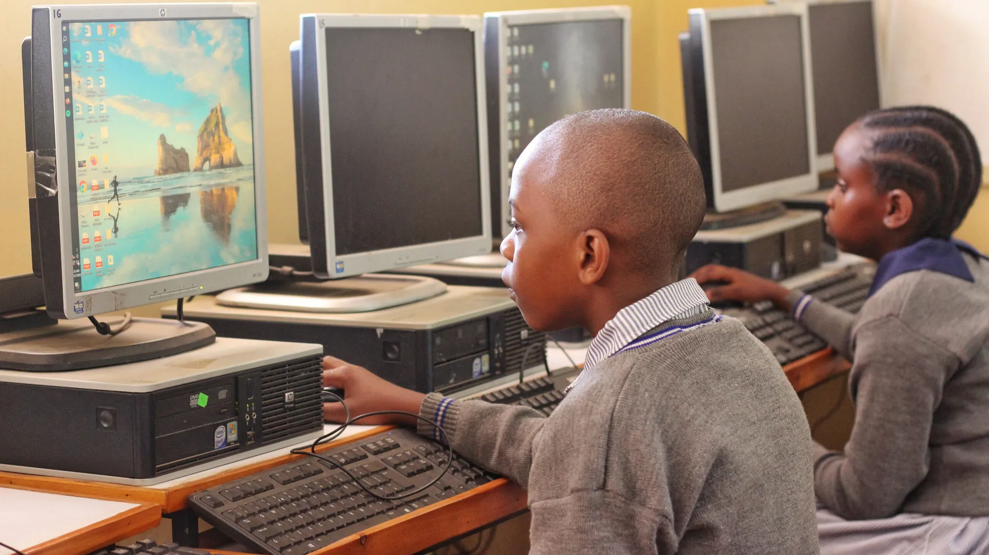 Two pupils working at computers in the school computer lab